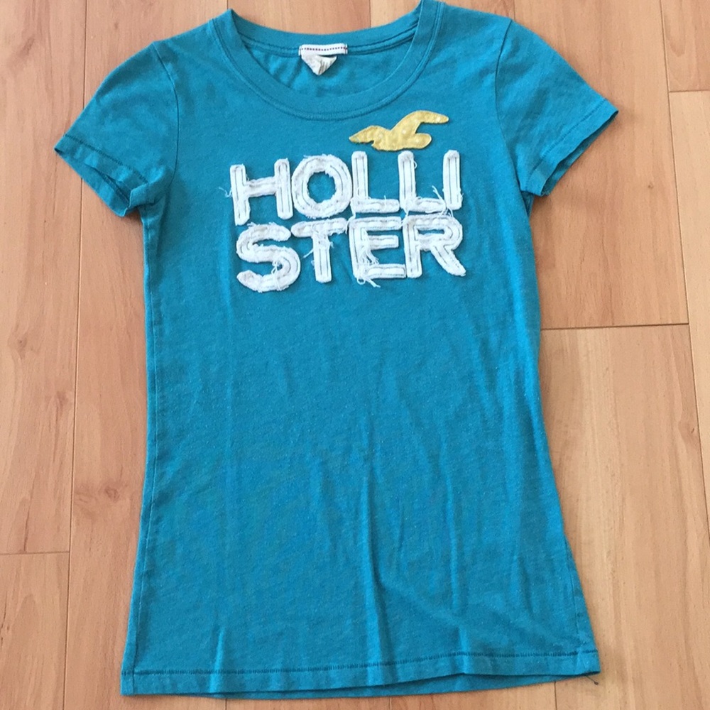 Blue Hollister tee.